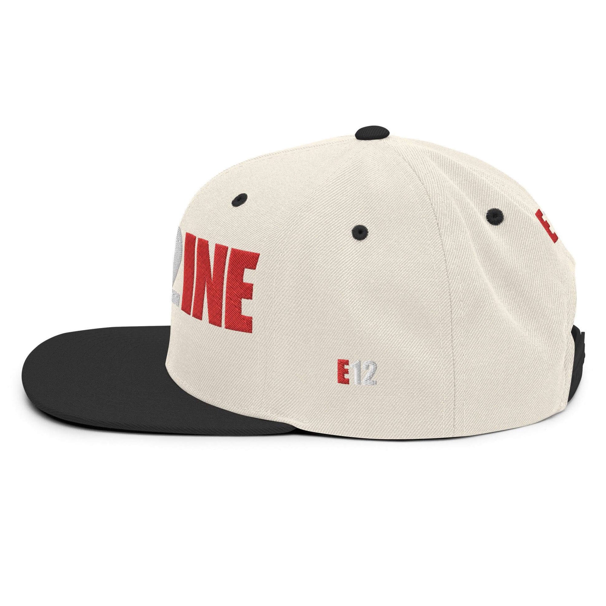 Custom firefighter snapback hat with cream fabric and black brim, featuring large red "E12" text for firehouse pride.
