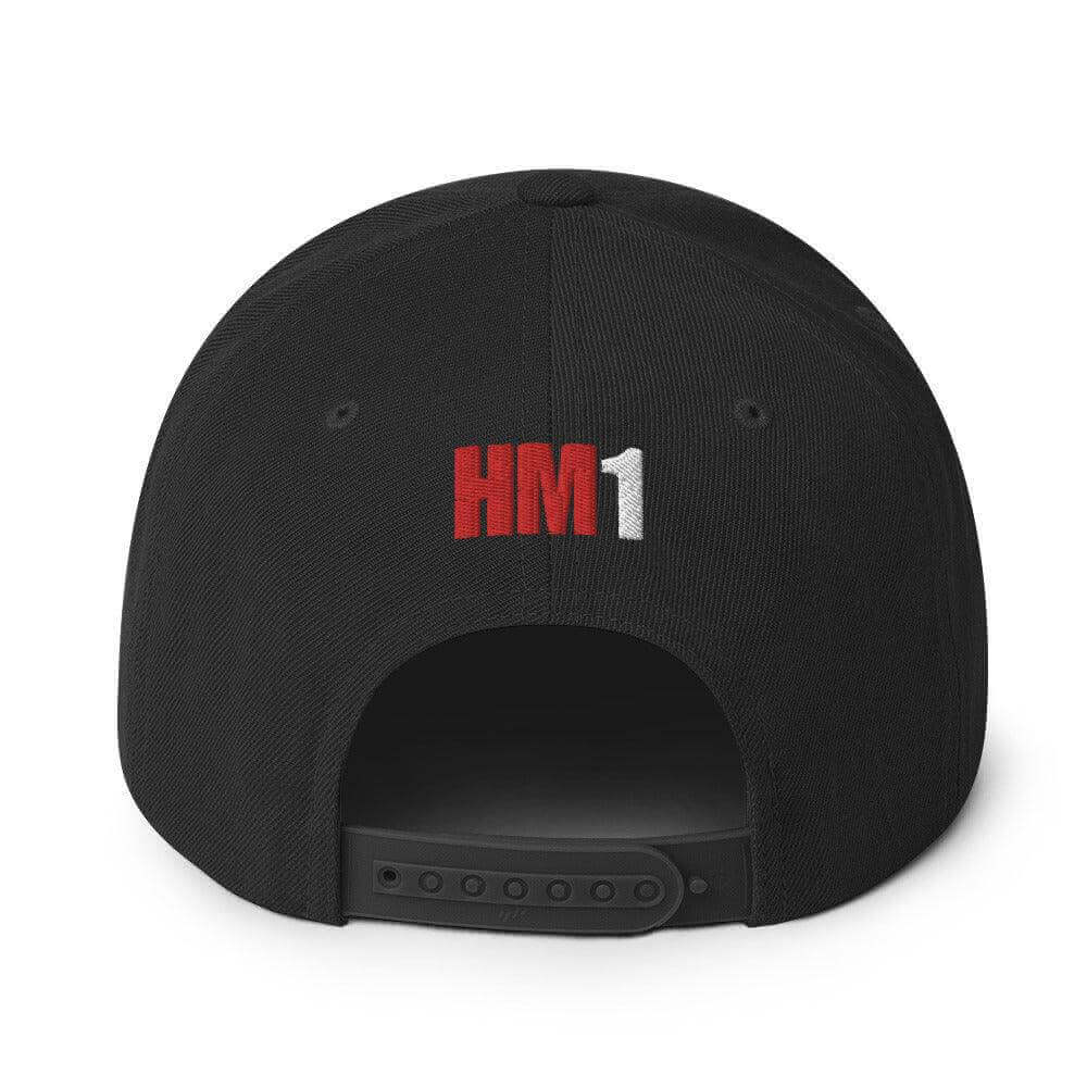 Back view of a structured black snapback hat with red and white "HM1" embroidery, ideal for firefighter apparel and gifts.