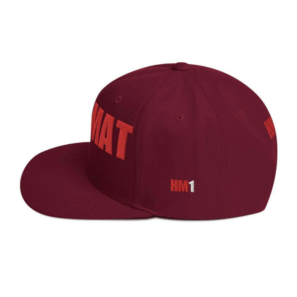 Red snapback hat with embroidered lettering, structured design, and flat brim, ideal for firefighter apparel and gifts.
