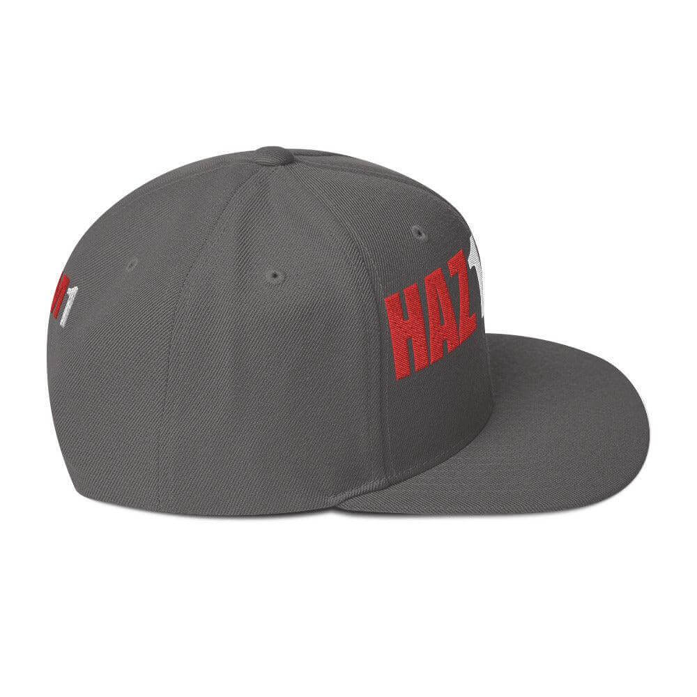 Snapback hat in gray with bold red 'HAZMAT' lettering, featuring a flat brim and adjustable snap closure for comfort.