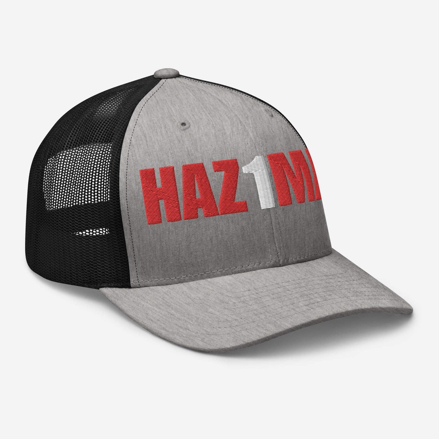 Gray trucker cap with black mesh back, featuring bold "HAZ1M" lettering, perfect for firefighter gear and gifts.