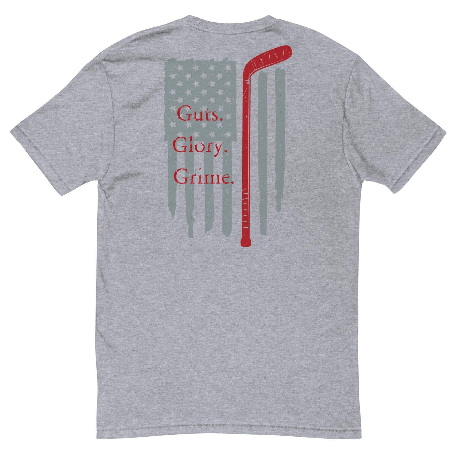 Gray t-shirt featuring a hockey stick design with "Guts. Glory. Grime." and a distressed American flag background.