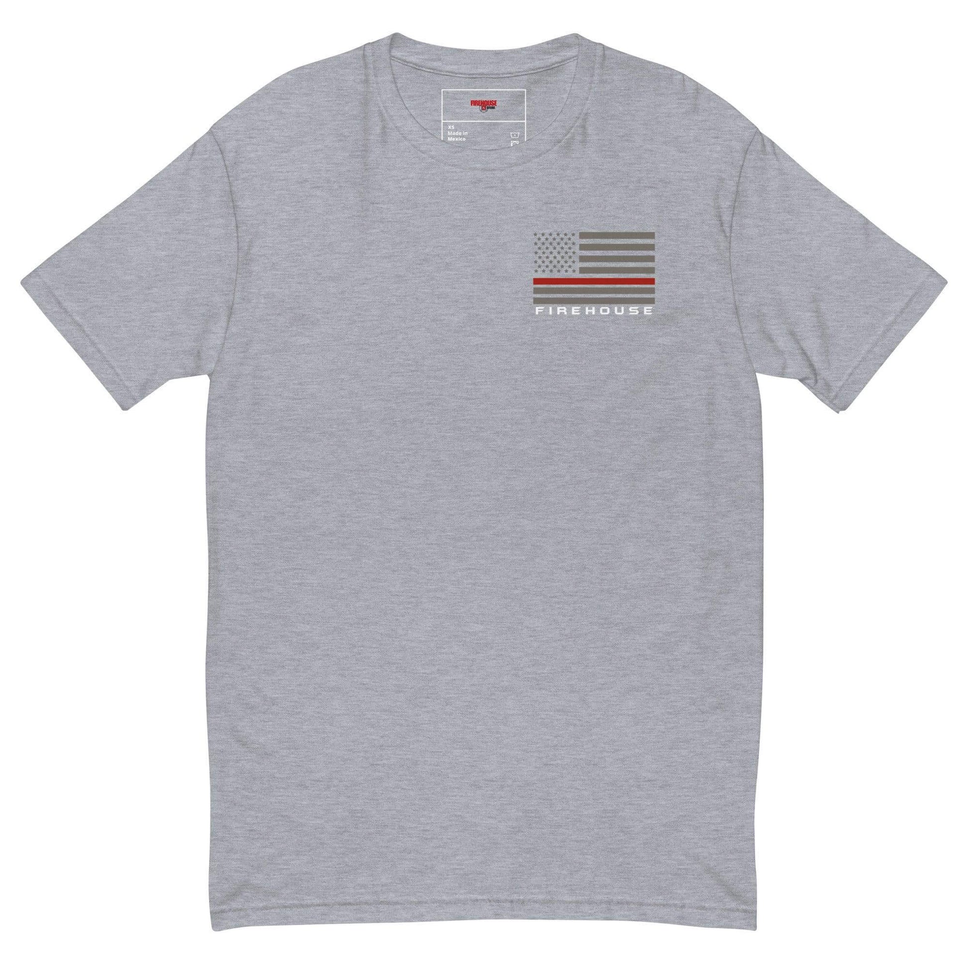 Soft grey short sleeve t-shirt featuring a firehouse graphic and American flag design, ideal firefighter apparel and gifts.