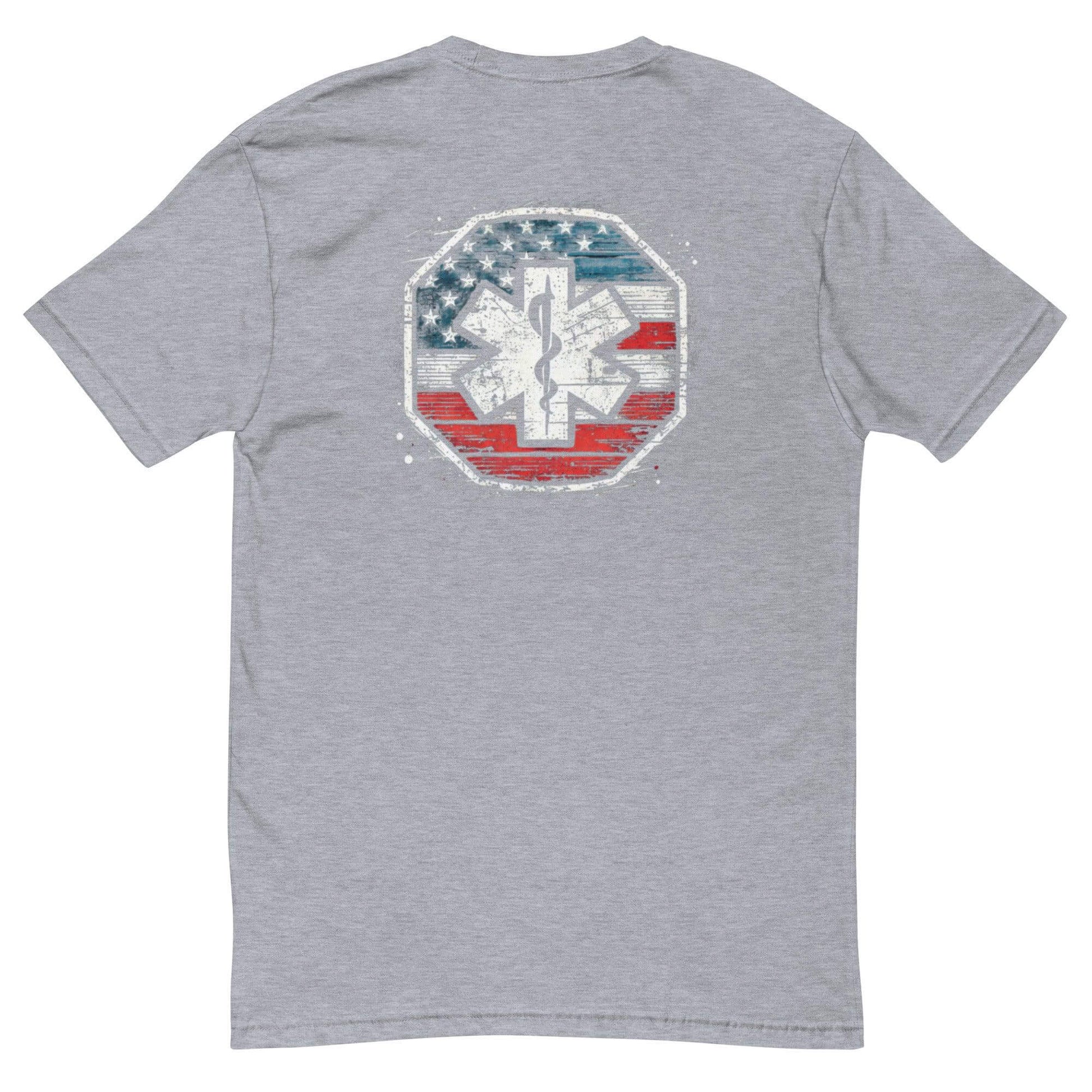 Back view of a gray short sleeve t-shirt featuring a patriotic EMS emblem design in red, white, and blue.