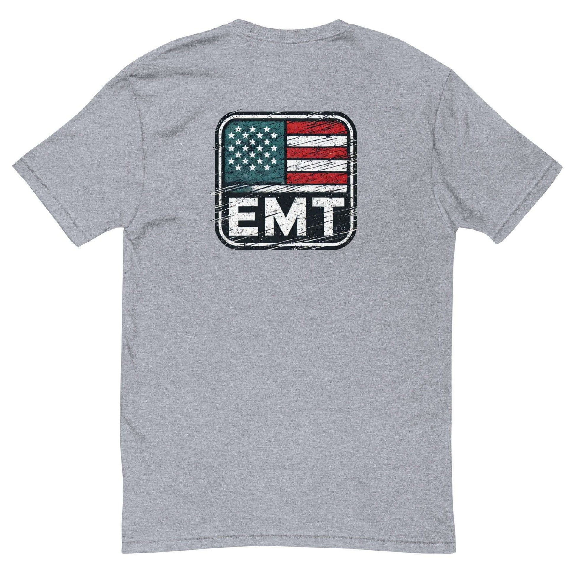 Grey t-shirt featuring a distressed American flag design with "EMT" printed on the back, ideal for emergency medical personnel.