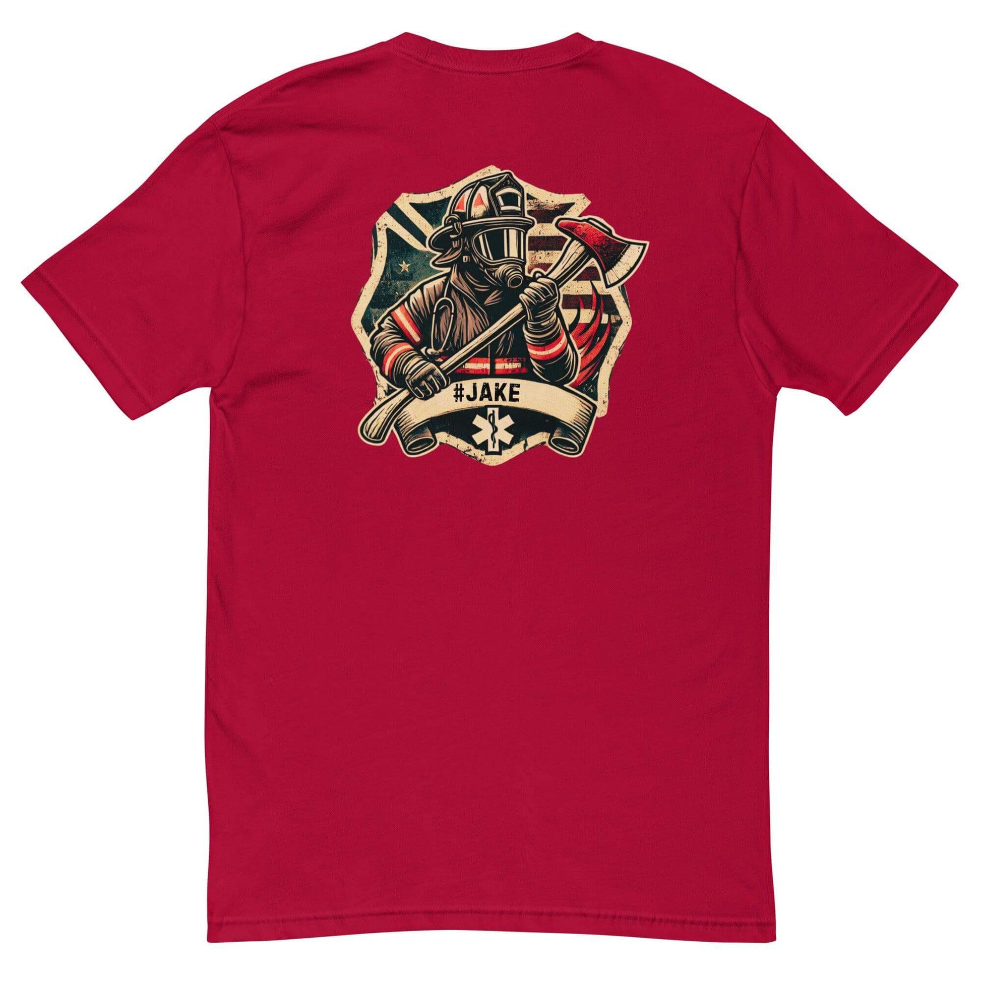 Red short sleeve t-shirt featuring a firefighter graphic design with an axe and "#JAKE" banner. Ideal firefighter apparel.